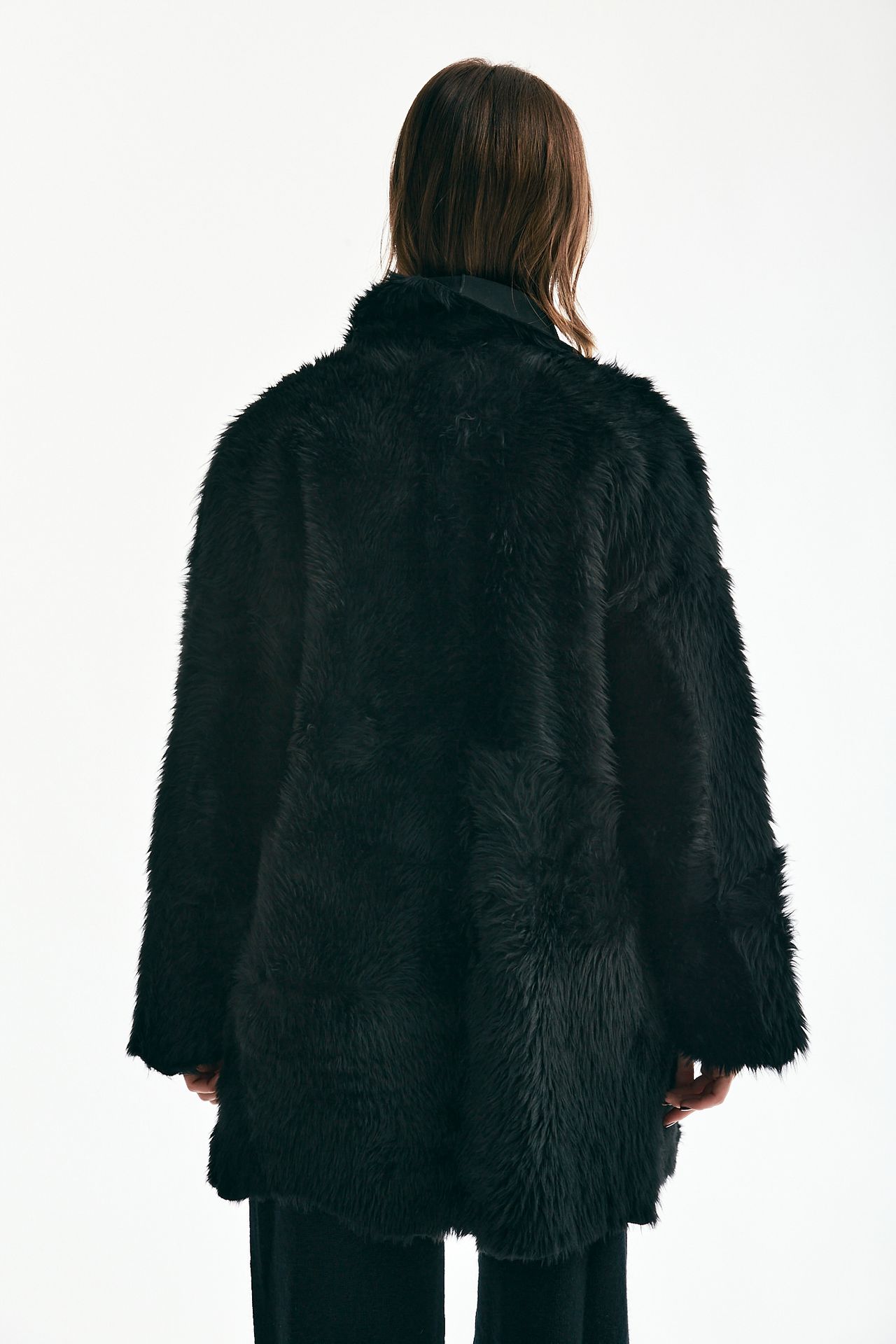 Giaccone in shearling nero